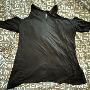 NWT Woman’s cold shoulder style, black shirt.